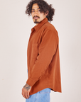 Side view of Oversize Overshirt in Burnt Terracotta worn by Jesse