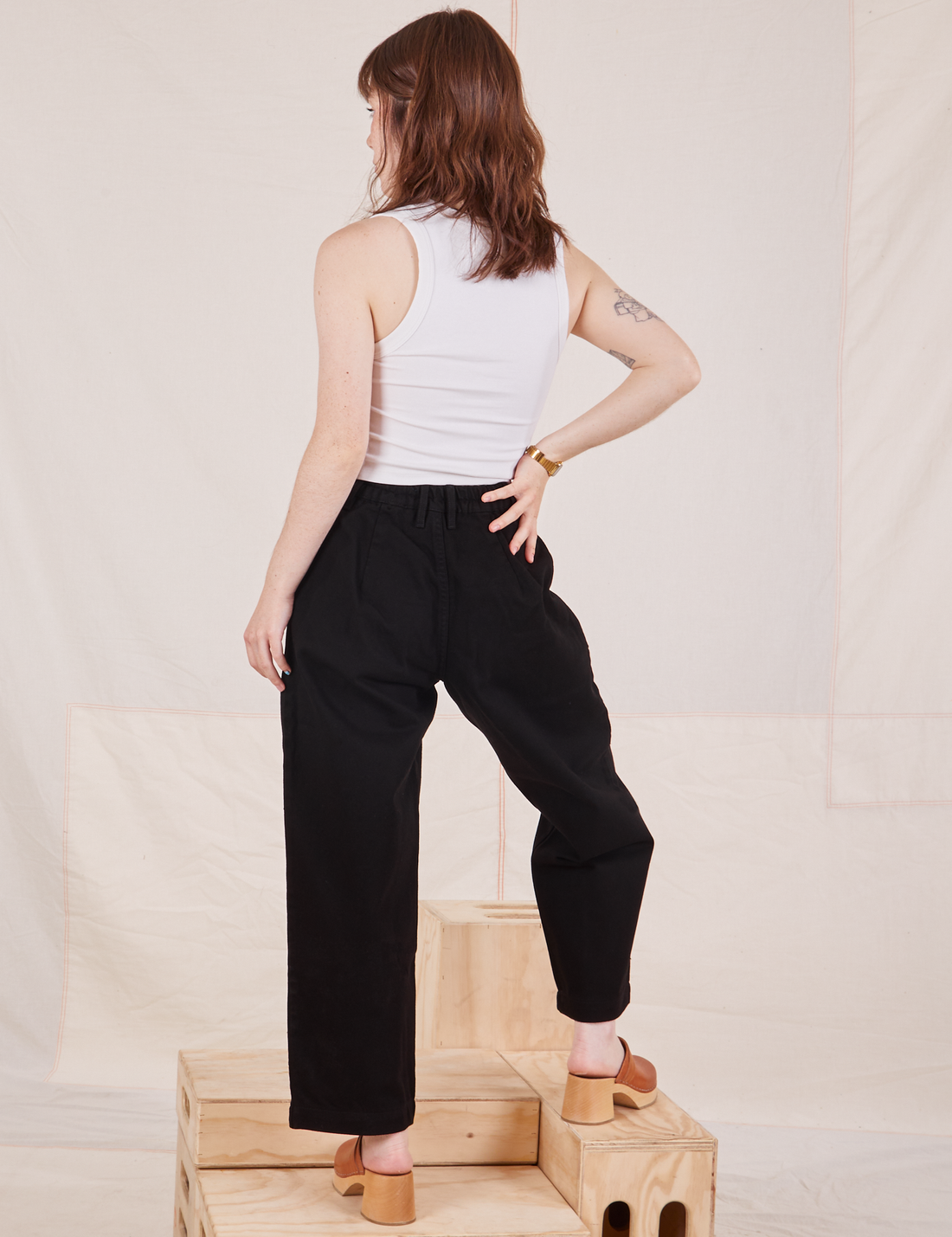 Back view of Denim Trouser Jeans in Black with vintage off-white Cropped Tank Top on Hana