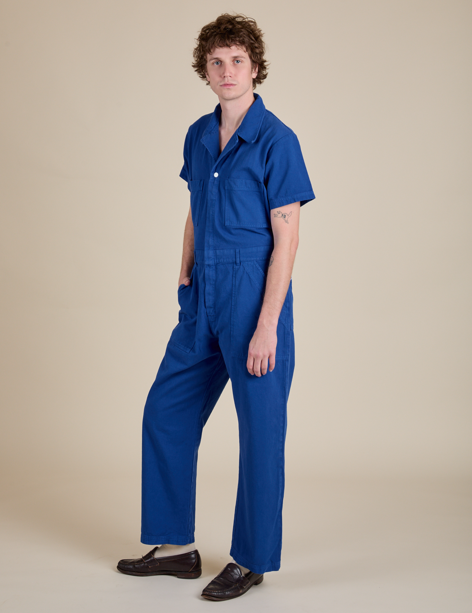 Angled front view of Short Sleeve Jumpsuit in Royal Blue on Quinn