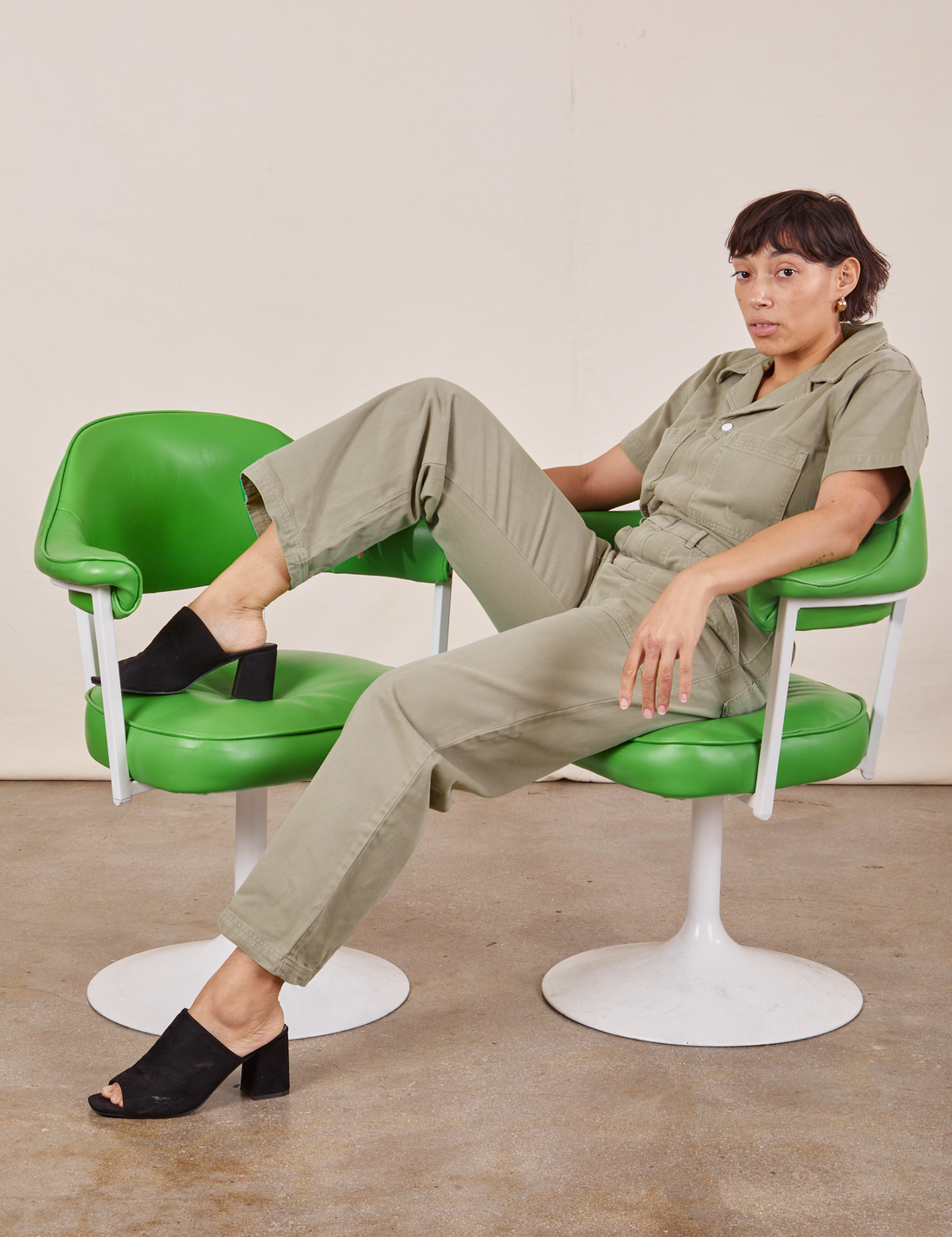 Tiara is wearing Short Sleeve Jumpsuit in Khaki Grey