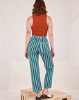 Back view of Stripe Work Pants in Green and burnt terracotta Cropped Tank Top worn by Alex