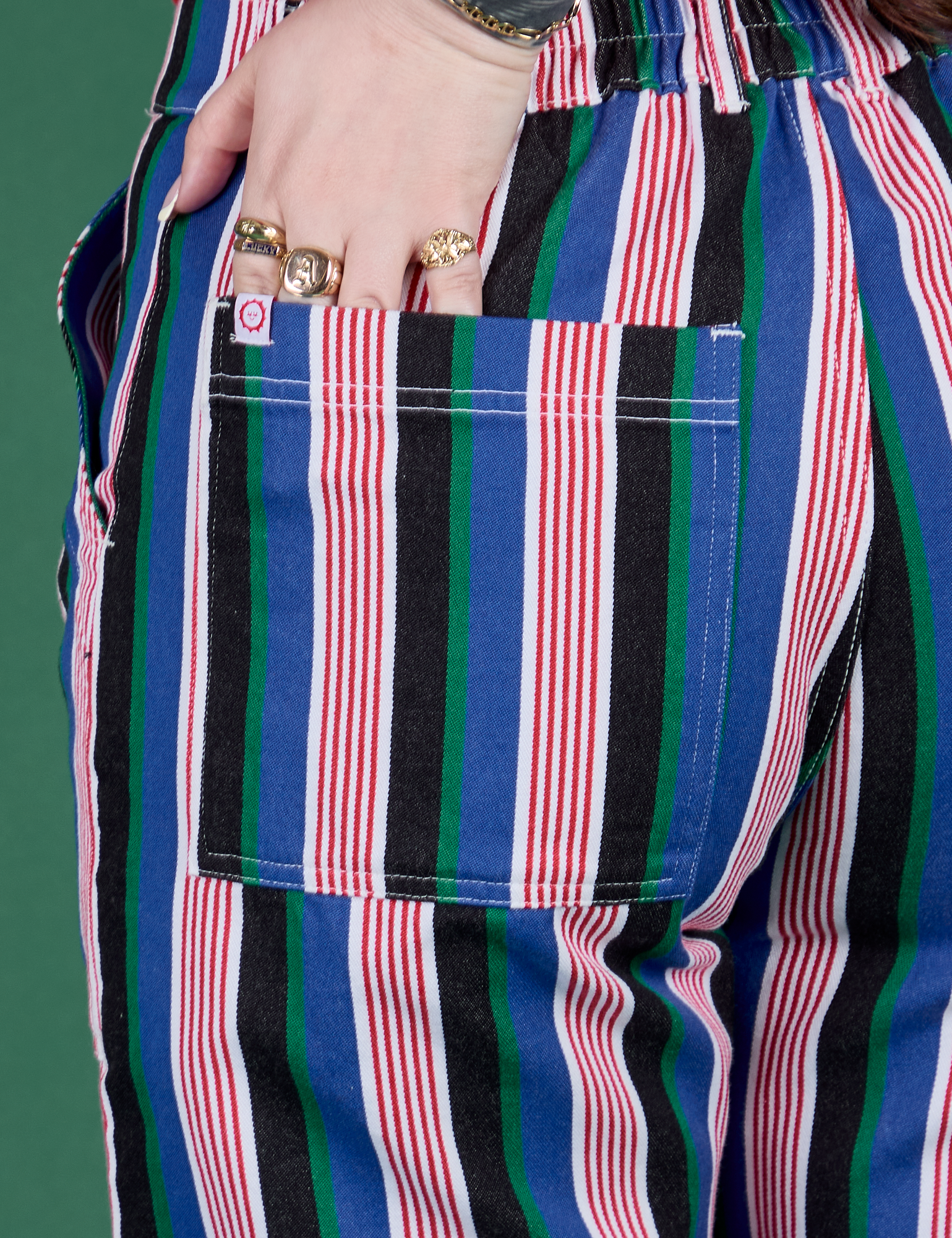 Close up of Sydney's hand in the back pocket of  Work Pants in Pacific Stripe