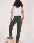 Back view of Heritage Trousers in Swamp Green and vintage off-white Cropped Tank Top