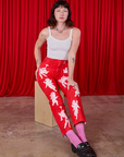 Alex is wearing Airbrush Cupid Work Pants and Cami in vintage tee off-white