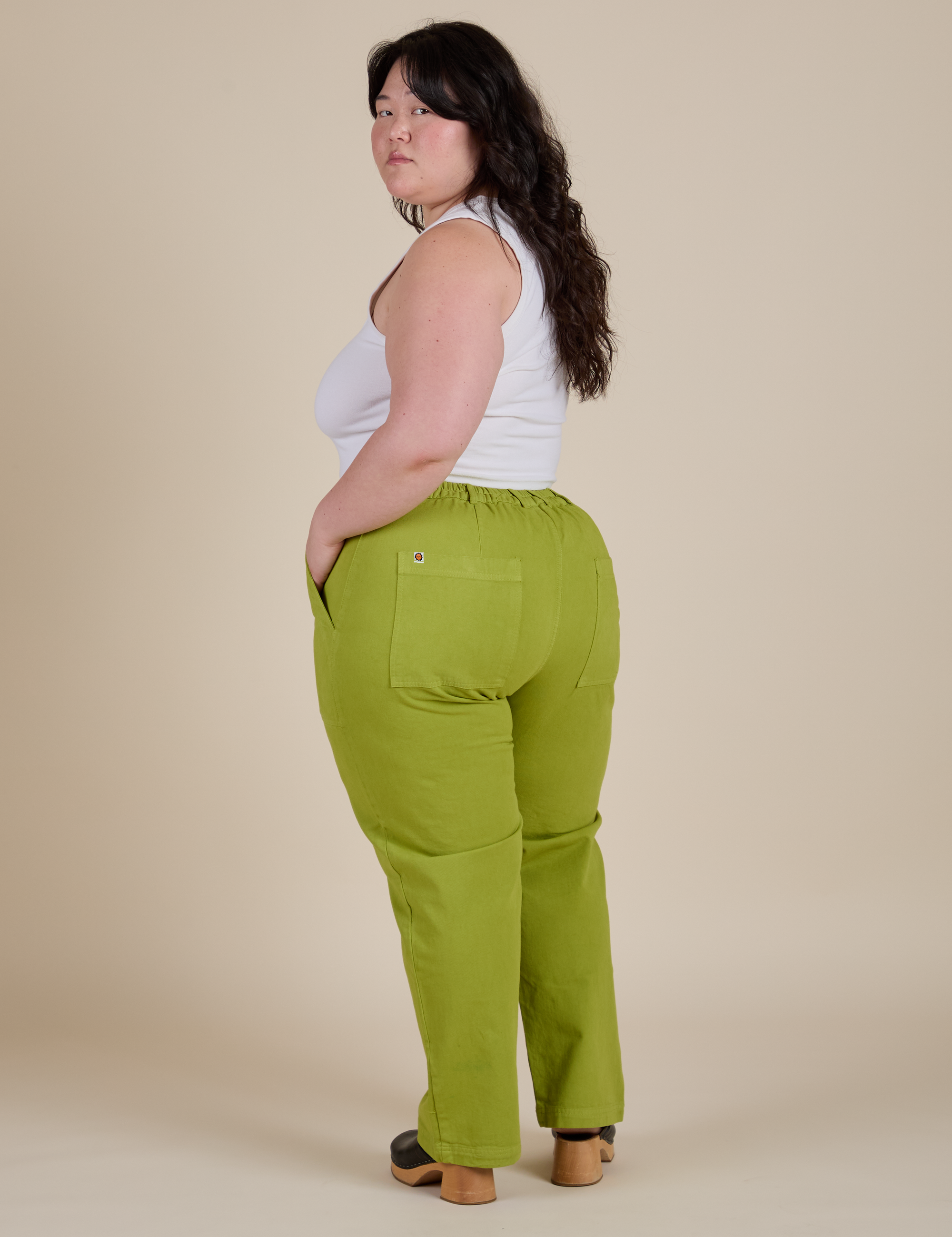 Angled back view of Work Pants in Gross Green on Ashley