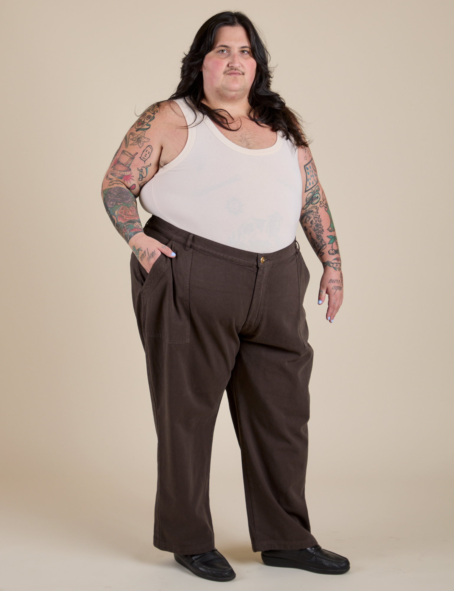 Angled front view of Work Pants in Espresso Brown and Tank Top in Vintage Tee Off-White on Sam