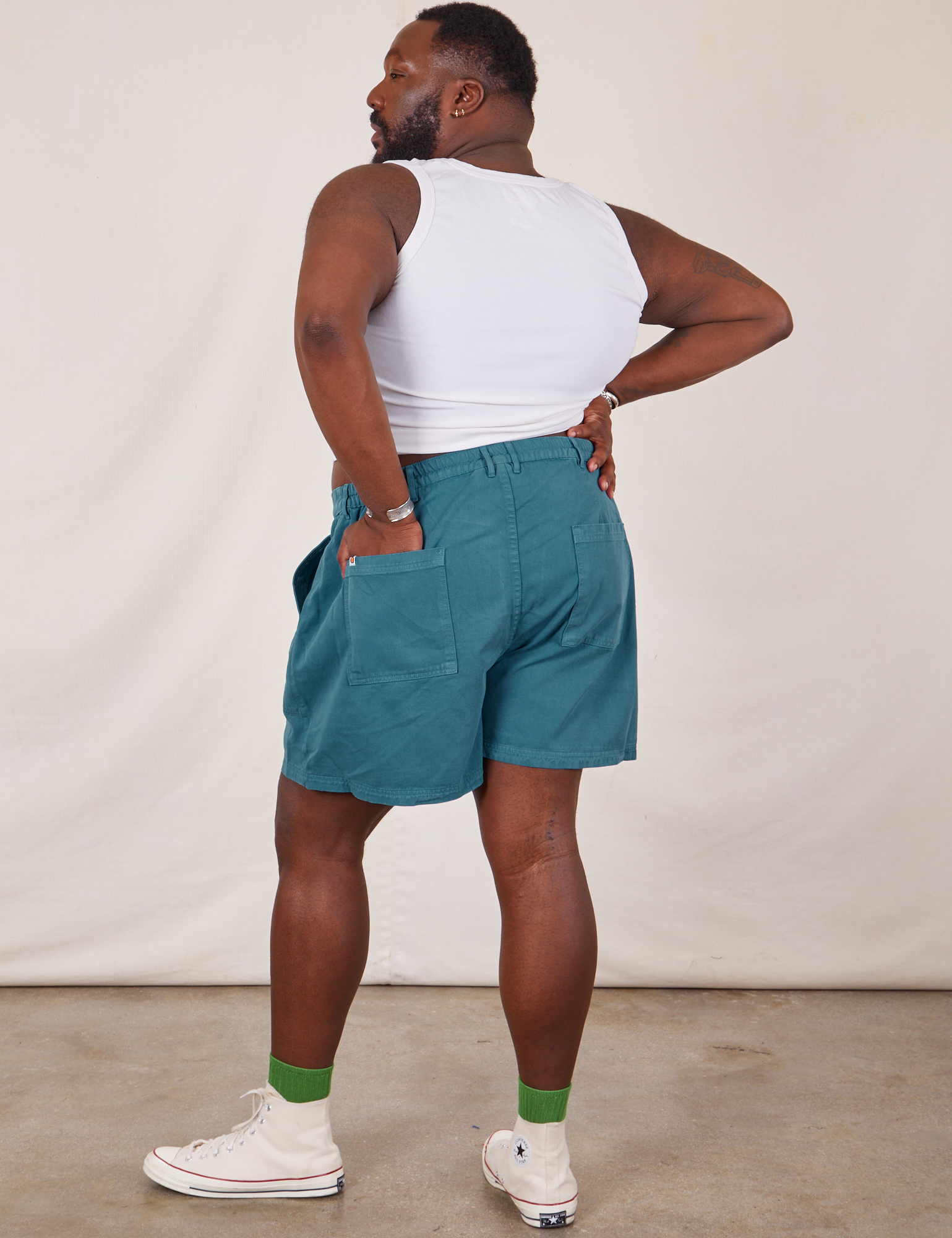 Back view of Classic Work Shorts in Marine Blue and Tank Top in vintage tee off-white on Elijah