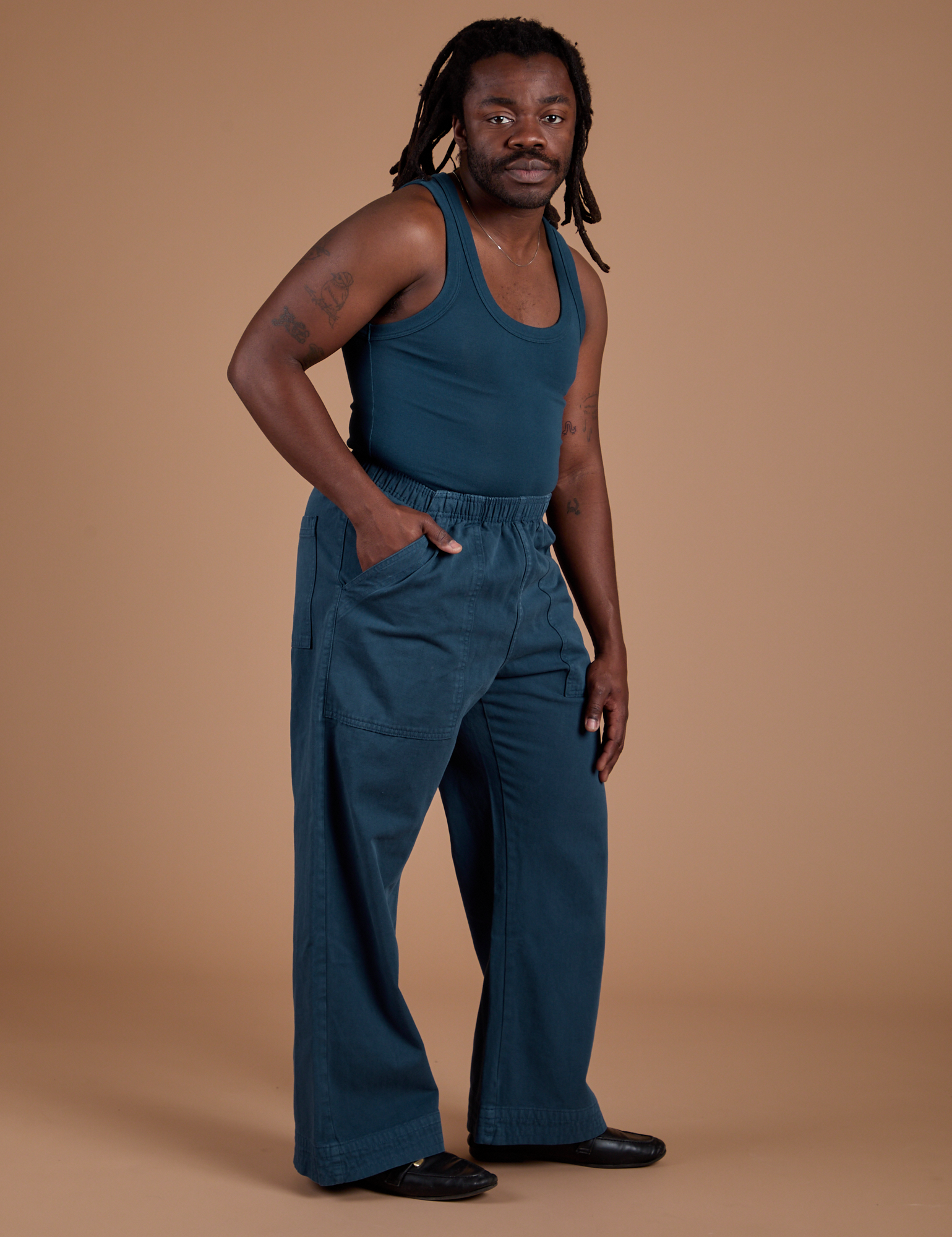 Angled front view of Action Pants in Lagoon on Demi