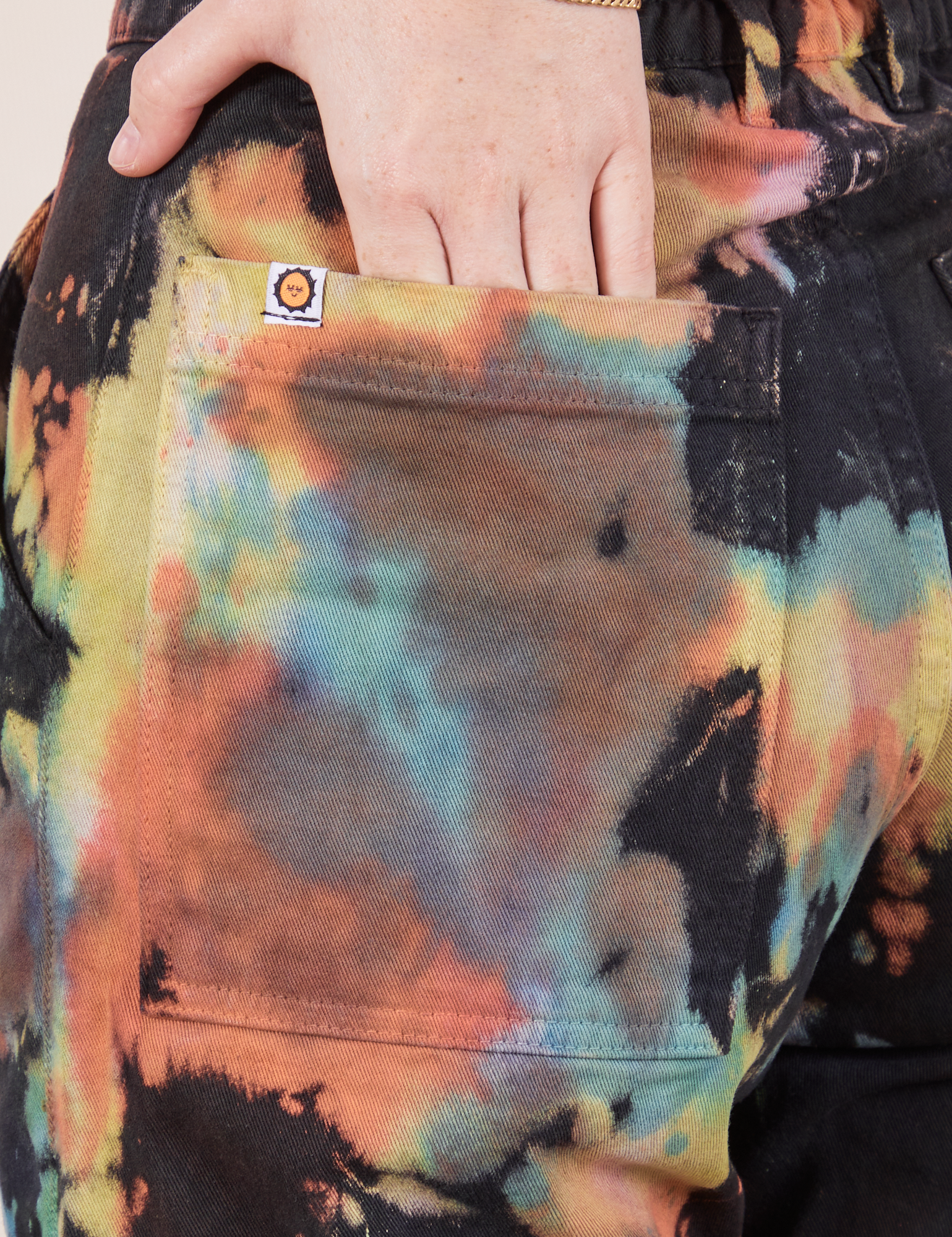 Back pocket close up of Rainbow Magic Waters Work Pants worn by Hana
