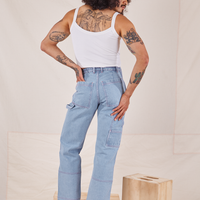Back view of Carpenter Jeans in Light Wash and vintage off-white Cami worn by Jesse
