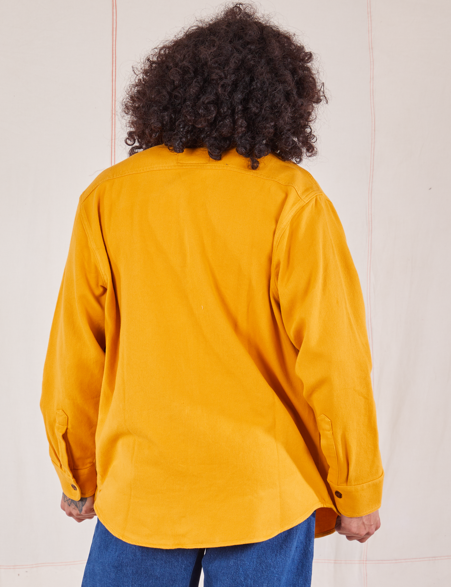 Back view of Flannel Overshirt in Mustard Yellow on Jesse