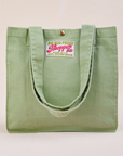 Shopper Tote Bag in Sage Green with straps hanging down front of bag