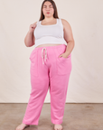 Marielena is wearing Cropped Rolled Cuff Sweatpants in Bubblegum Pink and vintage off-white Cropped Tank Top