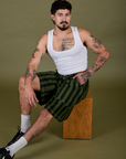 Jesse is wearing  Longline Work Shorts in Evergreen and vintage tee white Cropped Tank