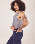 Side view of Mesh Tank Top in Periwinkle and navy Western Pants worn by Jesse