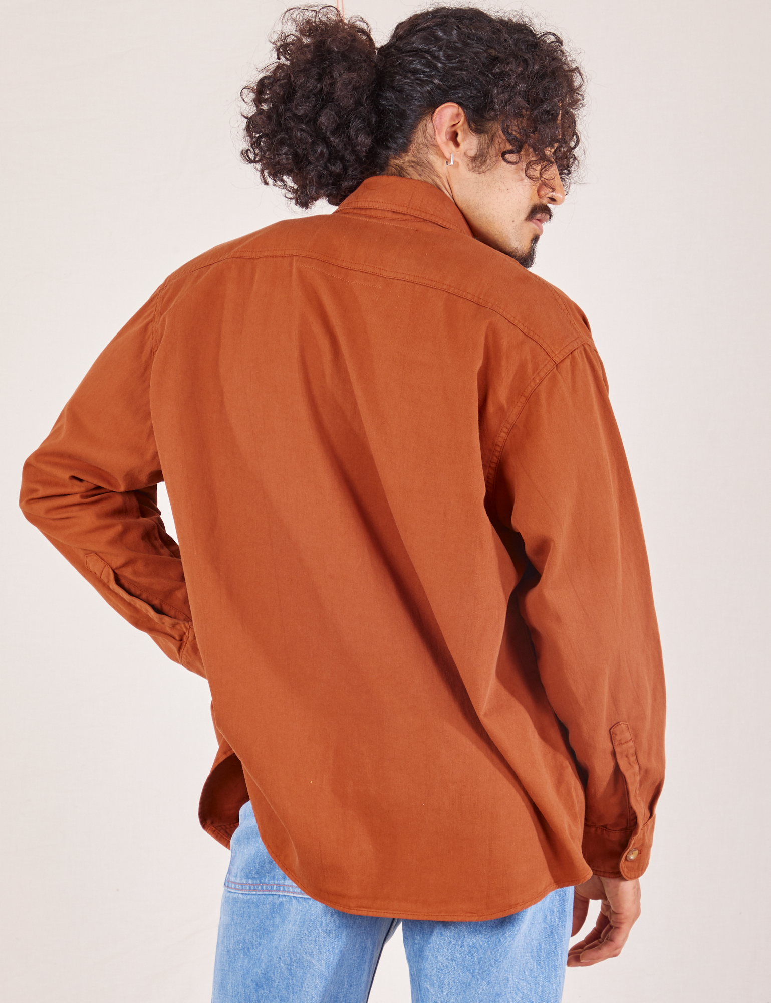 Back view of Oversize Overshirt in Burnt Terracotta worn by Jesse