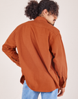 Back view of Oversize Overshirt in Burnt Terracotta worn by Jesse