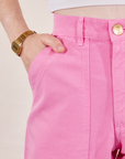 Petite Pencil Pants in Bubblegum Pink front pocket close up. Hana has her hand in the pocket.