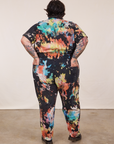 Back view of Short Sleeve Jumpsuit in Rainbow Magic Waters worn by Sam.