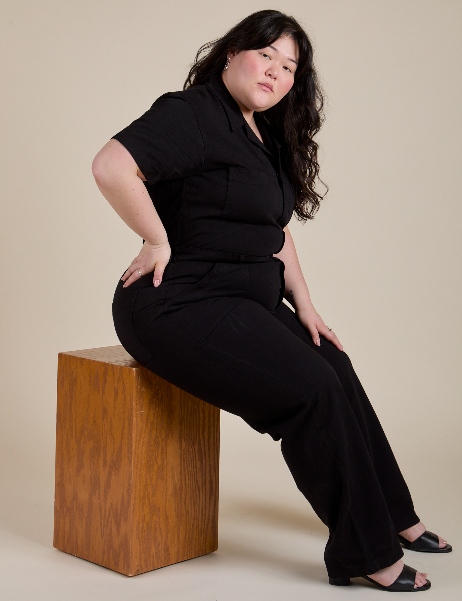 Ashley is wearing Short Sleeve Jumpsuit in Basic Black