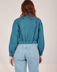 Back view of the Ricky Jacket in Marine Blue worn by Alex