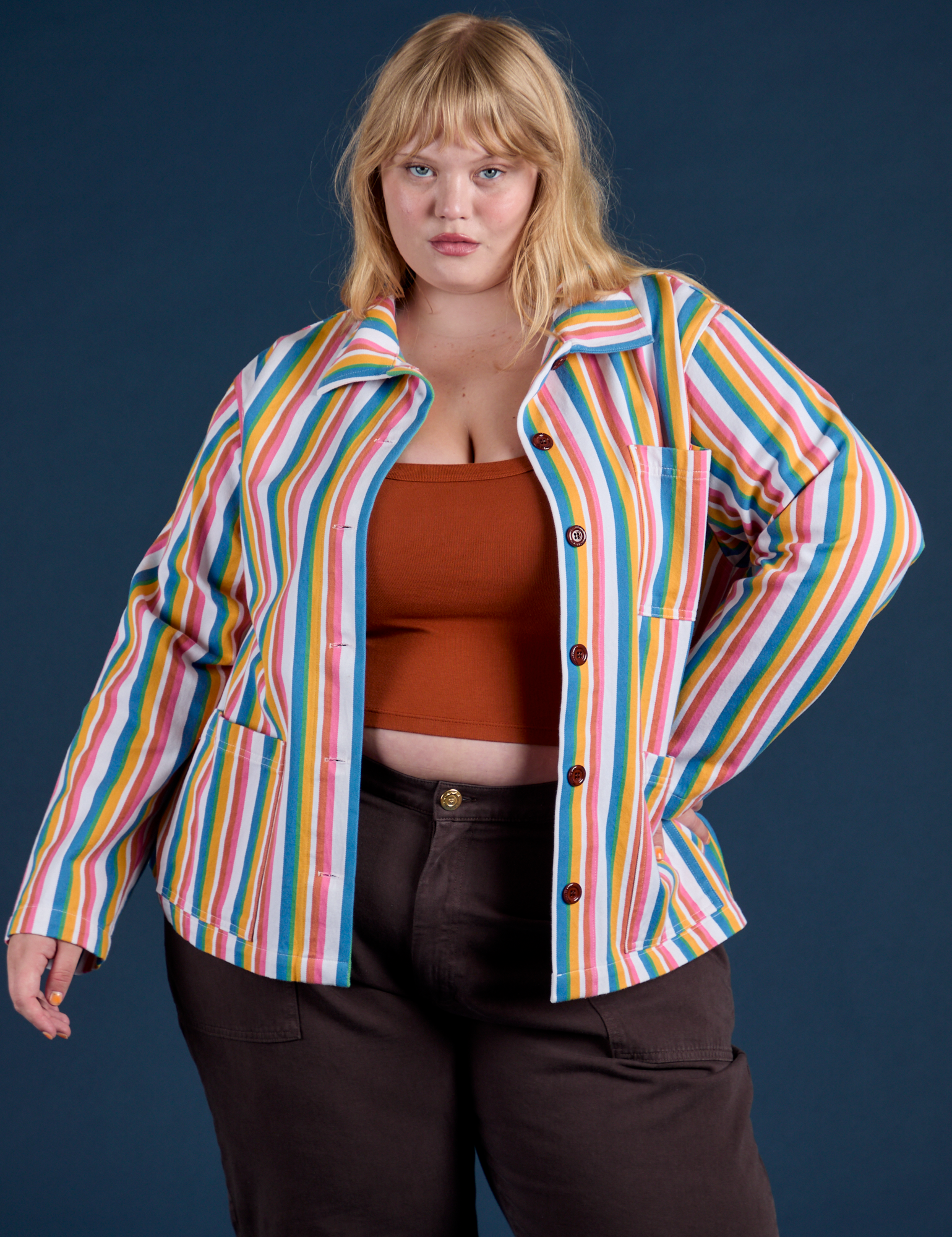 Juliet is 5’7” and wearing L Stripe Work Jacket in Rainbow Stripe