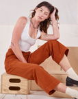 Alex is wearing Action Pants in Burnt Terracotta and Cropped Tank in vintage tee off-white