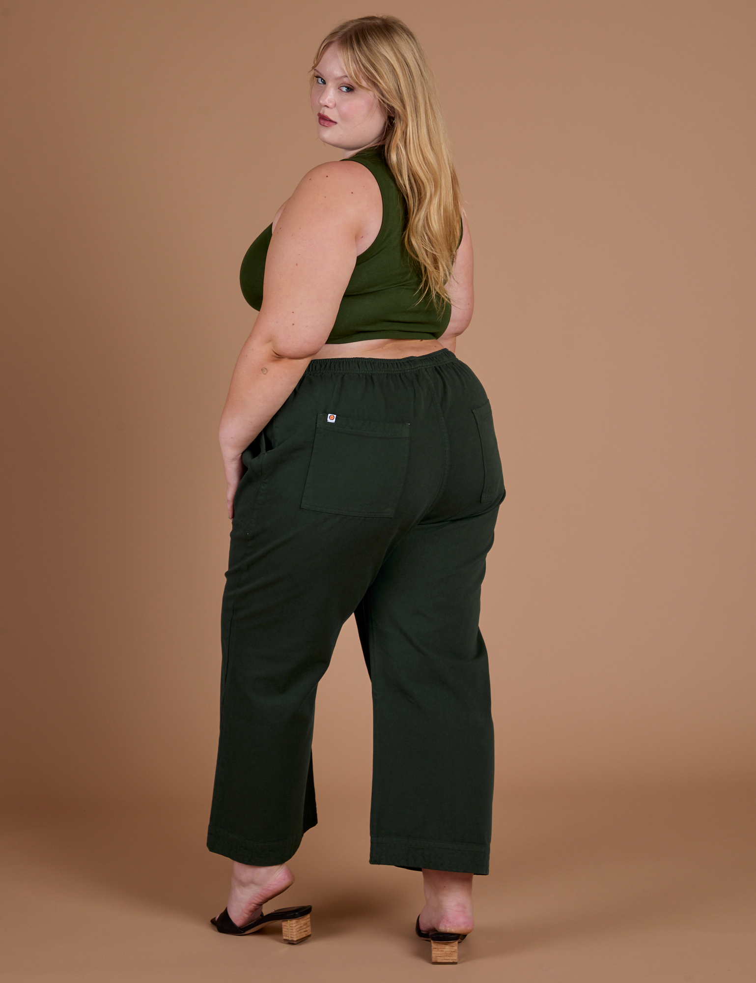 Action Pants in Swamp Green back view on Juliet