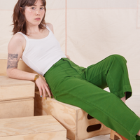 Hana is wearing Heritage Westerns in Lawn Green and vintage off-white Cropped Cami