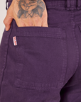Back pocket close up of Bell Bottoms in Nebula Purple worn by Jesse