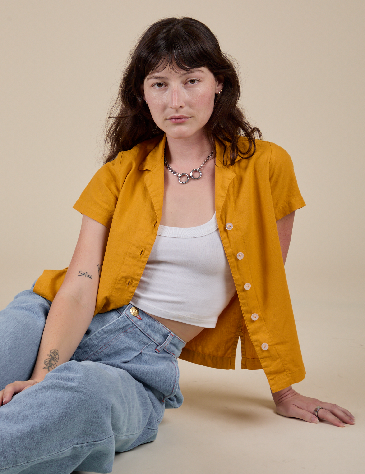 Alex is wearing Pantry Button-Up in Mustard Yellow