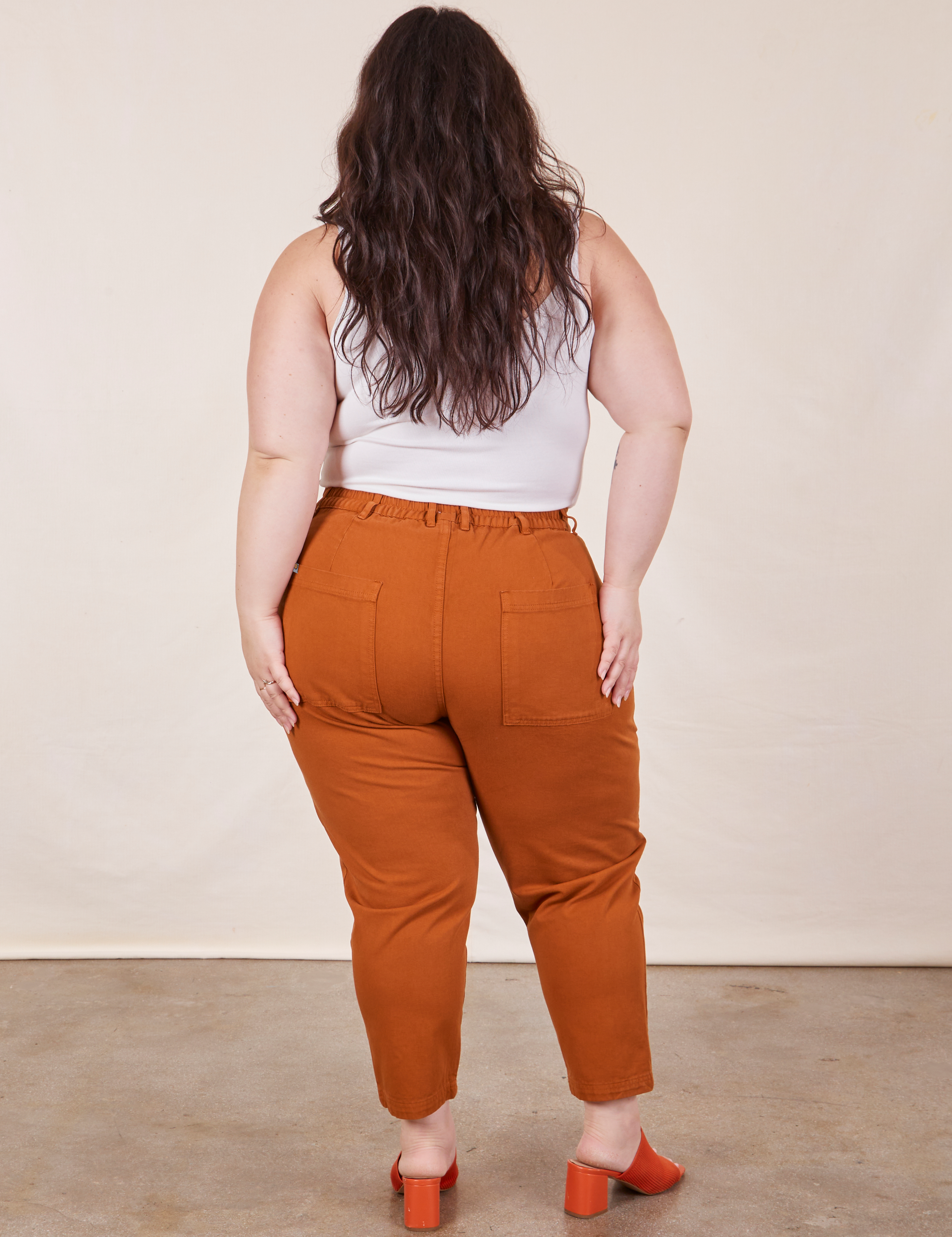 Back view of Petite Pencil Pants in Burnt Terracotta on Ashley