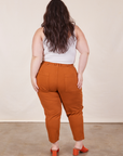 Back view of Petite Pencil Pants in Burnt Terracotta on Ashley