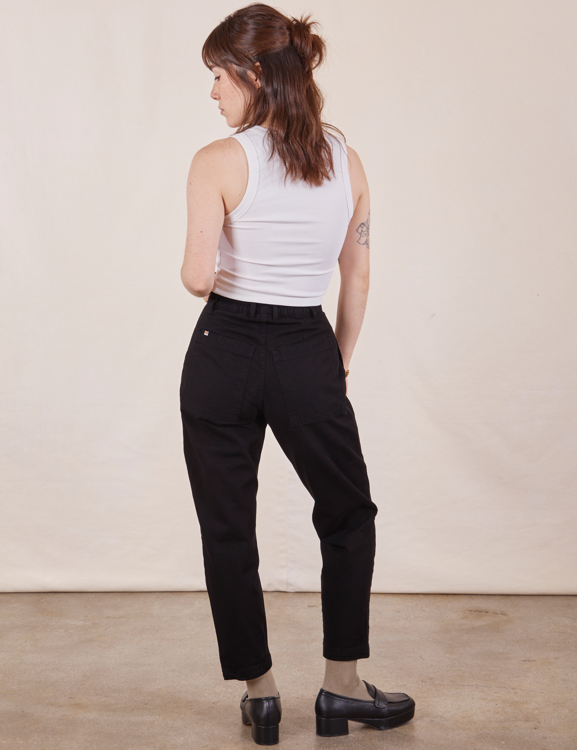 Back view of Petite Pencil Pants in Basic Black and vintage off-white Cropped Tank Top worn by Hana