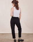 Back view of Petite Pencil Pants in Basic Black and vintage off-white Cropped Tank Top worn by Hana