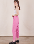 Side view of Petite Pencil Pants in Bubblegum Pink and vintage off-white Cropped Cami on Hana