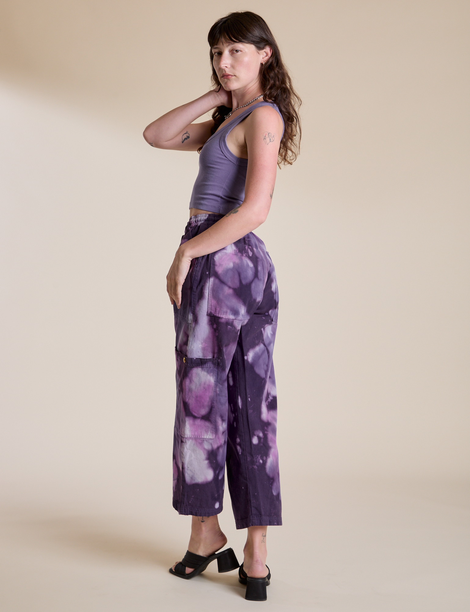 Magic Waters Drop Pocket Pants in Dark Lavender angled back view on Alex
