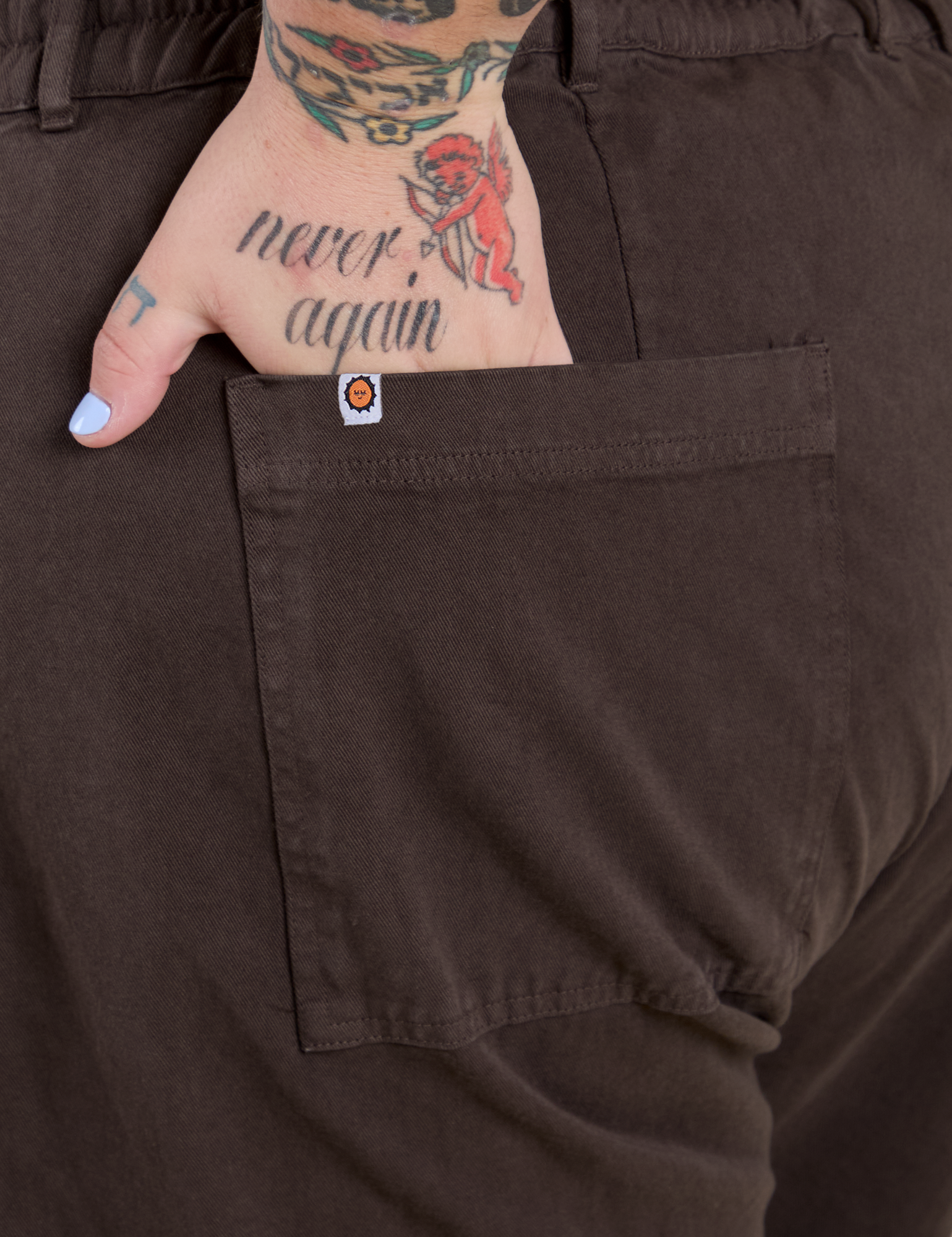 Close up of Sam's hand in the back pocket of Work Pants in Espresso Brown