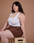 Ashley is wearing Classic Work Shorts in Fudgesicle Brown and Cropped Tank in Vintage Tee White