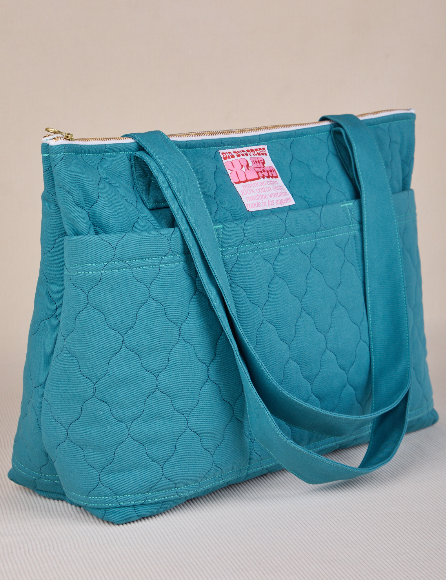 Angled view of Quilted XL Tote in Marine Blue