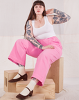 Sydney is wearing Action Pants in Bubblegum Pink and Cropped Tank Top in vintage tee off-white