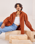 Jesse is wearing Oversize Overshirt in Burnt Terracotta paired with vintage off-white Cropped Tank Top