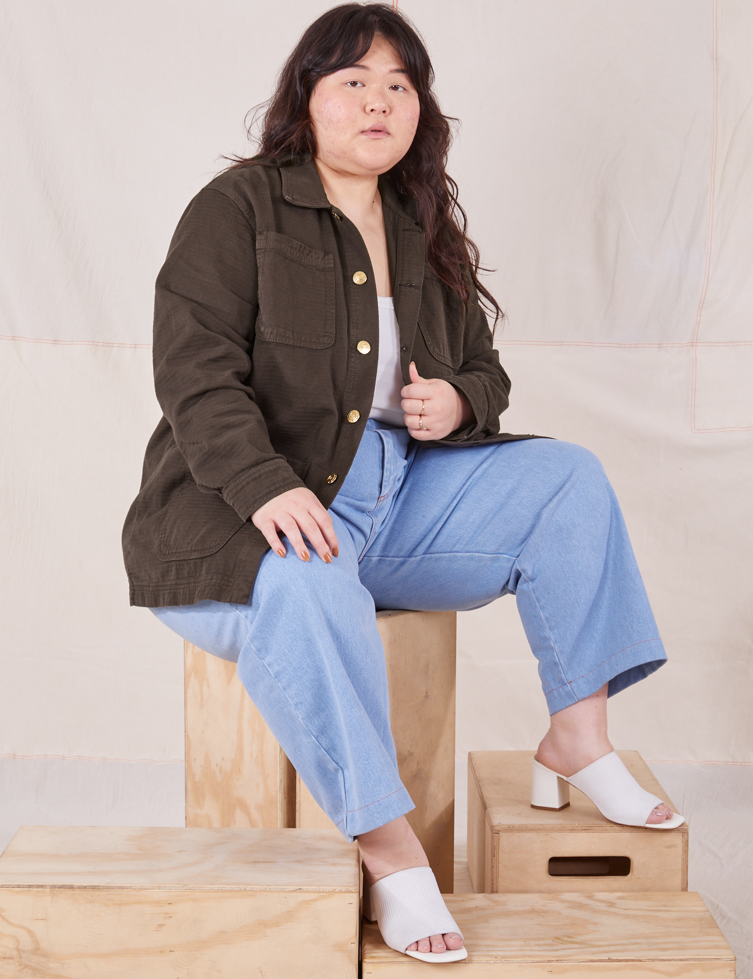Ashley is wearing Field Coat in Espresso Brown and light wash Trouser Jeans