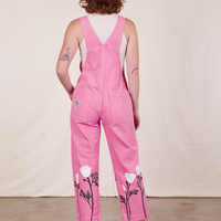 Back view of California Poppy Overalls in Bubblegum Pink and vintage off-white Tank Top worn by Alex