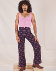 Jesse is 5'8" and wearing XS Western Pants in Purple Tile Jacquard paired with bubblegum pink Cropped Tank Top