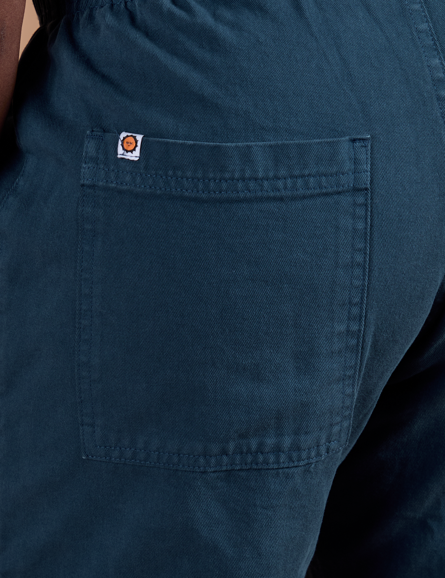 Action Pants in Lagoon back pocket close up on Demi