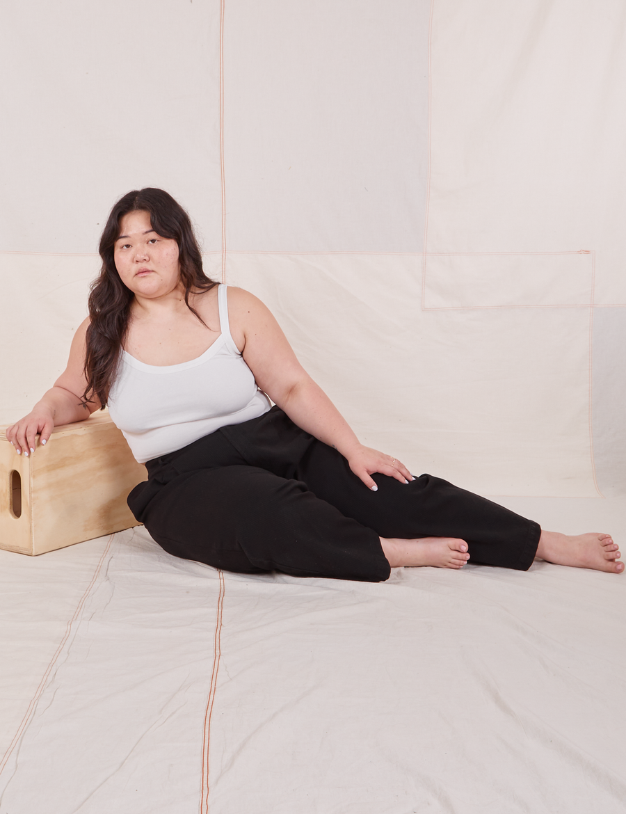 Ashley is wearing Heritage Trousers in Basic Black and vintage off-white Cropped Cami