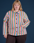 Juliet is wearing a buttoned up Stripe Work Jacket in Rainbow Stripe