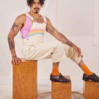 Jesse is wearing Rainbow Overalls and bubblegum pink Cropped Tank Top