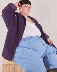 Jordan is wearing Corduroy Overshirt in Nebula Purple and a vintage off-white Cropped Tank Top underneath paired with light wash Denim Trouser Jeans